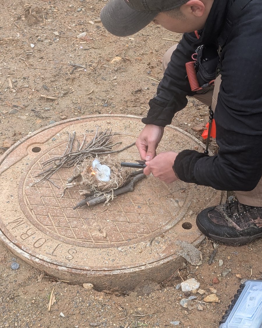 Practicing fire-starting skills in the field